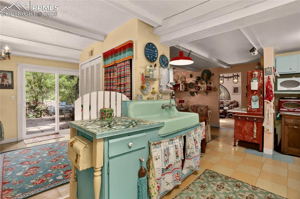 Kitchen access to den & patio