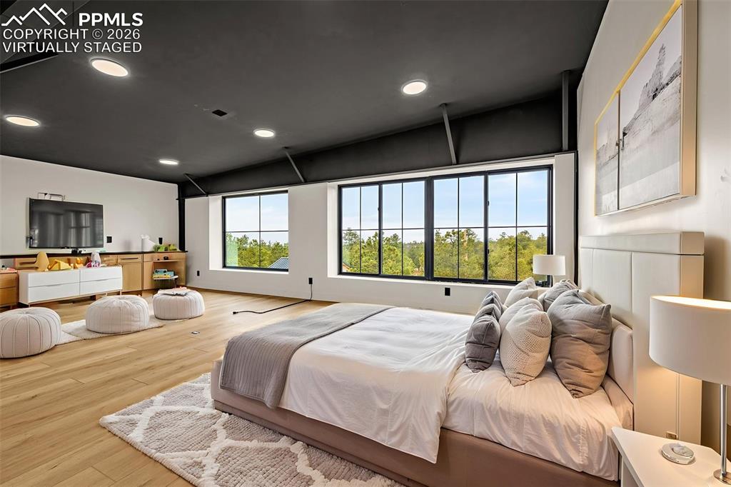 Virtually staged. Bedroom 2 view of Pike's Peak. Upper Level