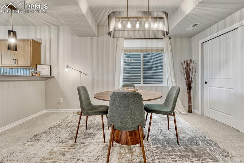 Basement has a wet bar and dining area, could be game area