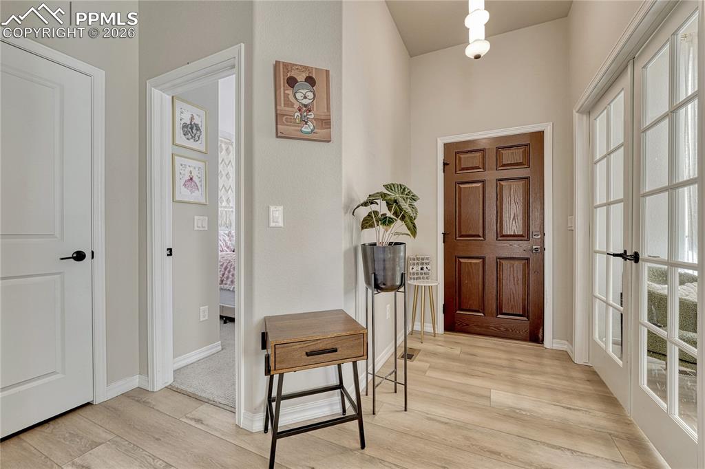 Beautiful wide plank LVP throughout main level, carpet in bedrooms