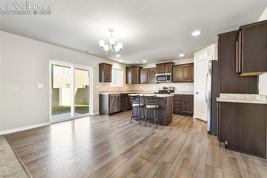 Kitchen and dining with walk out to patio