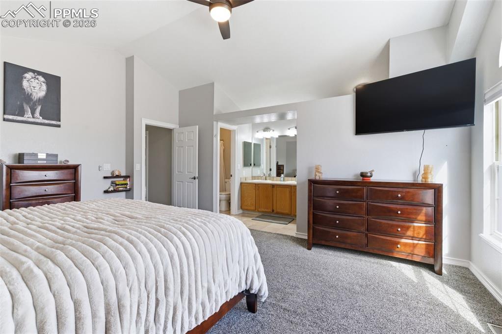 Natural lighting spills in, architectural touches, and overall openness warms and brighten this primary bedroom. 