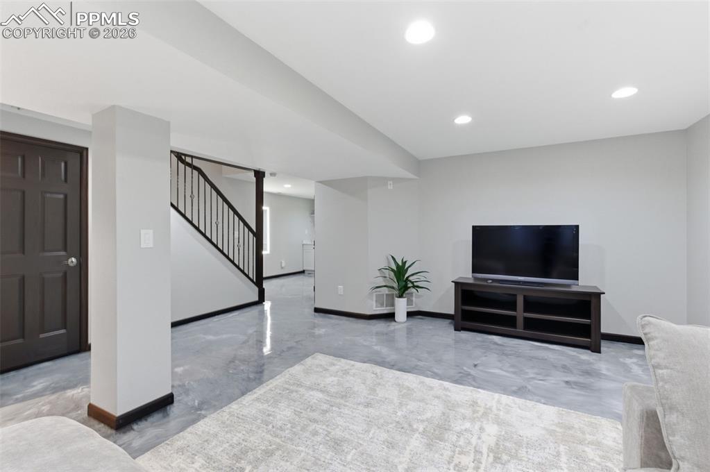 Open stairway; recessed lighting; newer carpet - it's a great space to unwind watching a movie or wind-up and play games!