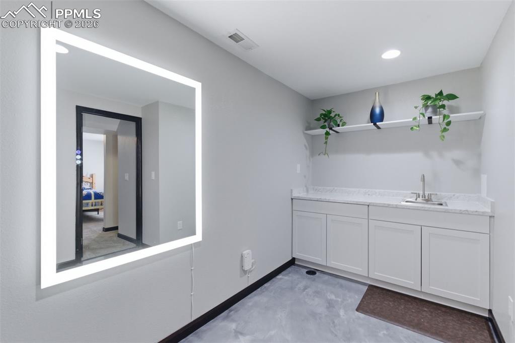 Don't miss this great wet bar with space for a microwave and/or coffee pot. 