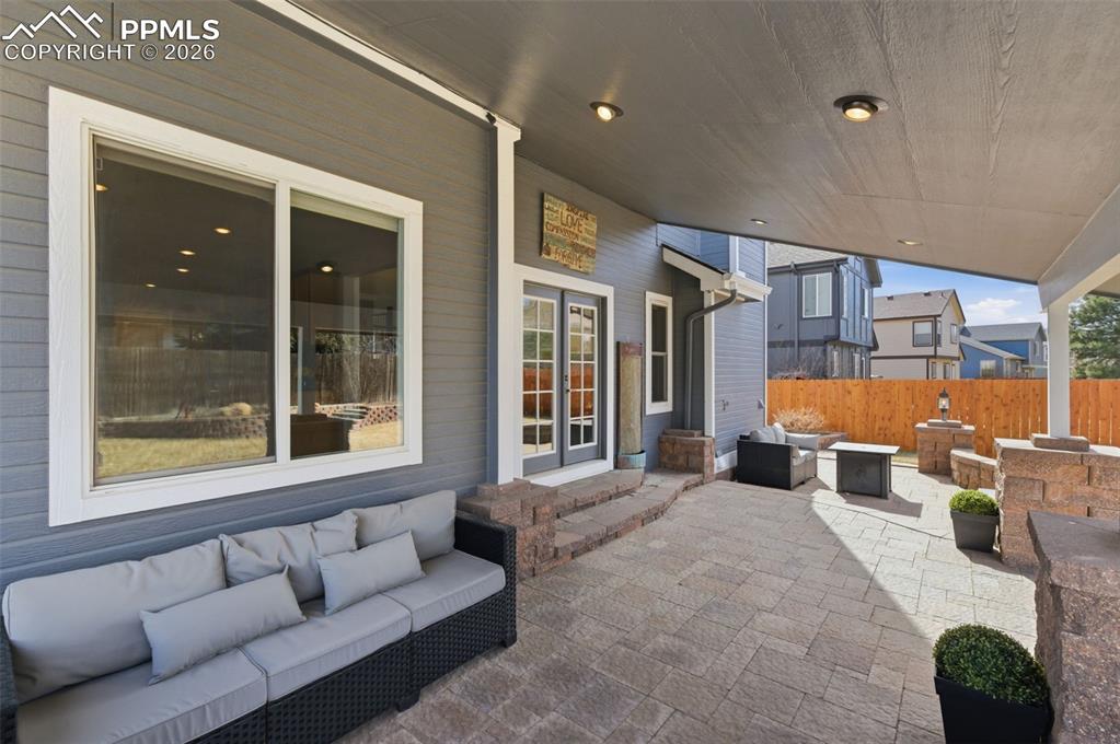 This fabulous covered patio can be used year-round enjoyment. Notice the incredible stone work and lighting!