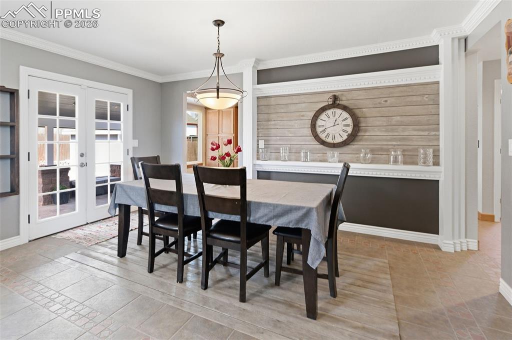 Double doors allow extra nat'l light and easy access to the covered back patio