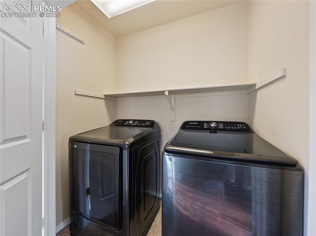 Laundry area featuring separate washer and dryer