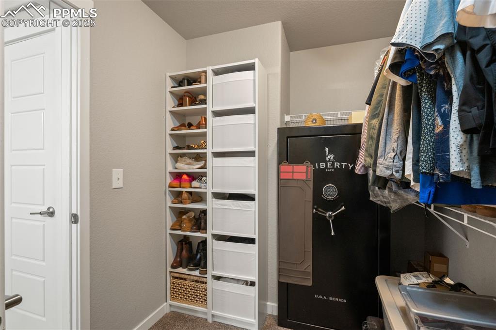 Spacious closet with carpet flooring