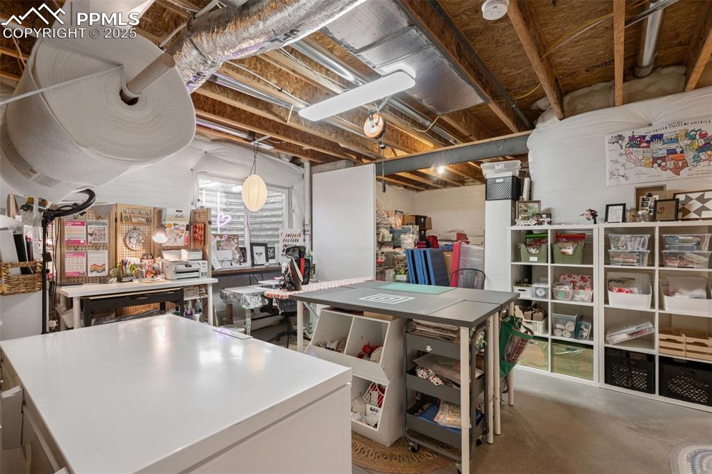 Unfinished below grade area with a workshop area