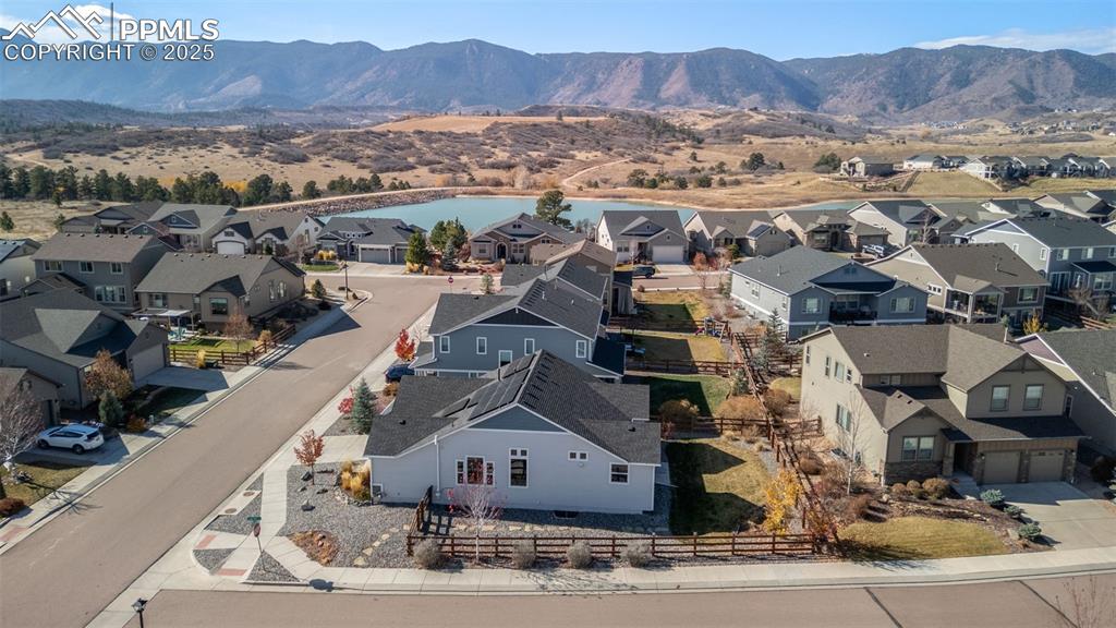 Aerial perspective of suburban area featuring a water and mountain view