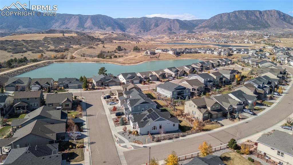 Aerial perspective of suburban area with a water and mountain view