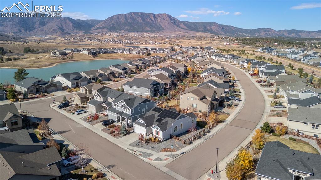 Aerial perspective of suburban area featuring a water and mountain view