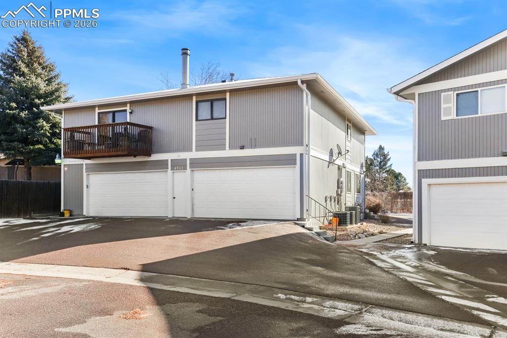 Attached shared garage in the back of the unit.