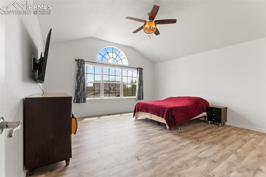Primary Bedroom with Vaulted Ceiling, French Doors for En-suite and Walk-In Closet 