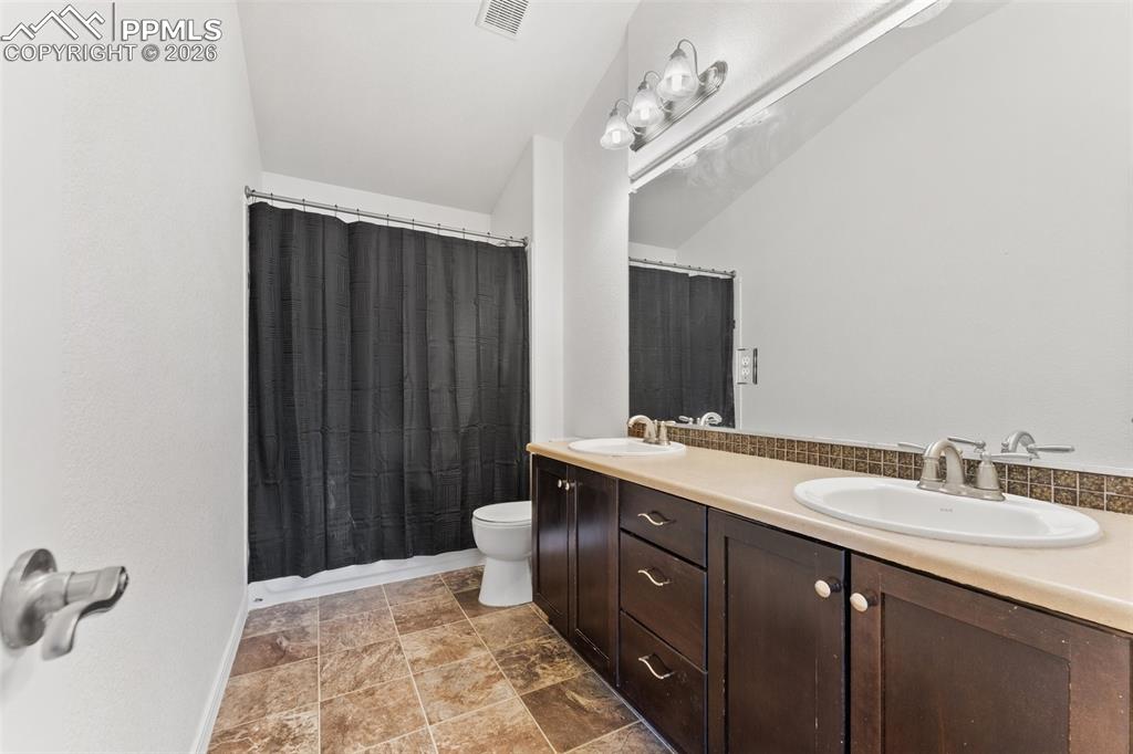 Upper Level Full Bath with High Ceilings and Dual Vanity