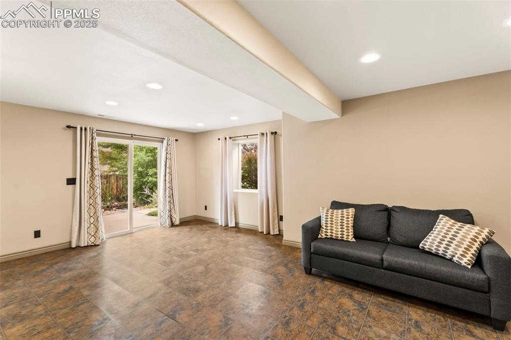 Family room in basement with walk-out to backyard. 