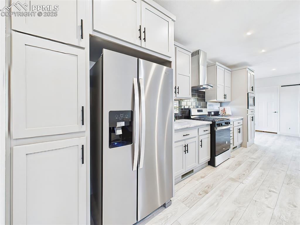 Abundant cabinet storage, built-in microwave, and refrigerator with ice/water dispenser.