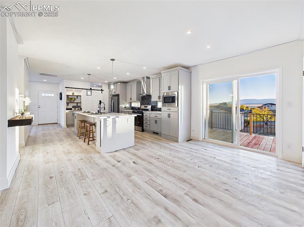 Bright and open dining area with sliding glass doors leading to outdoor living space.