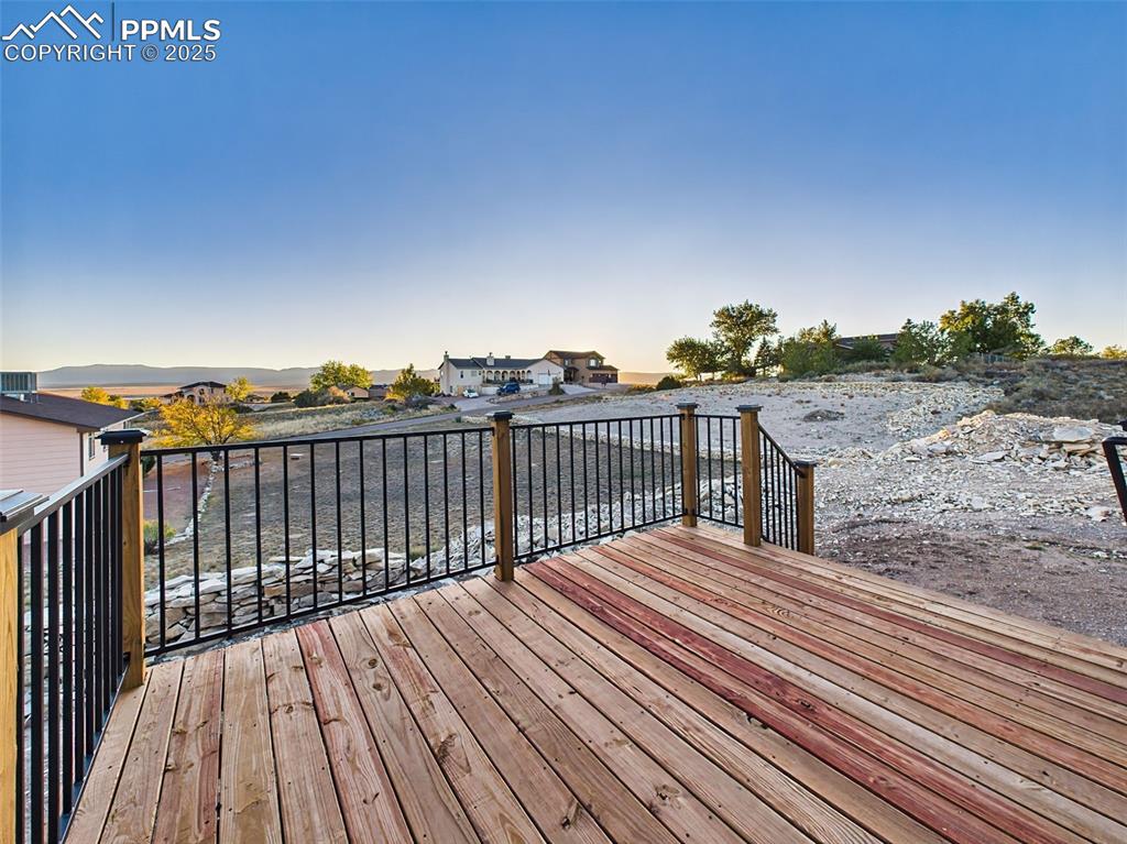 Wood deck with mountain backdrop—perfect for entertaining or relaxing outdoors.