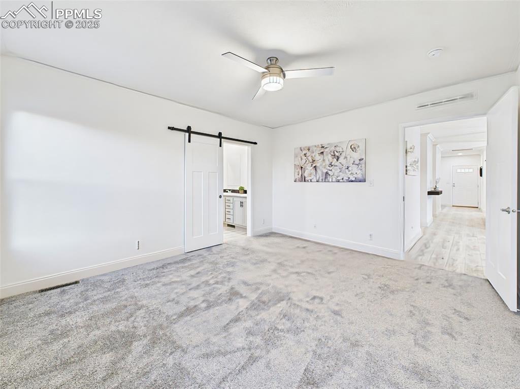 Unstaged layout highlighting walk-in closet entry and access to private bath.