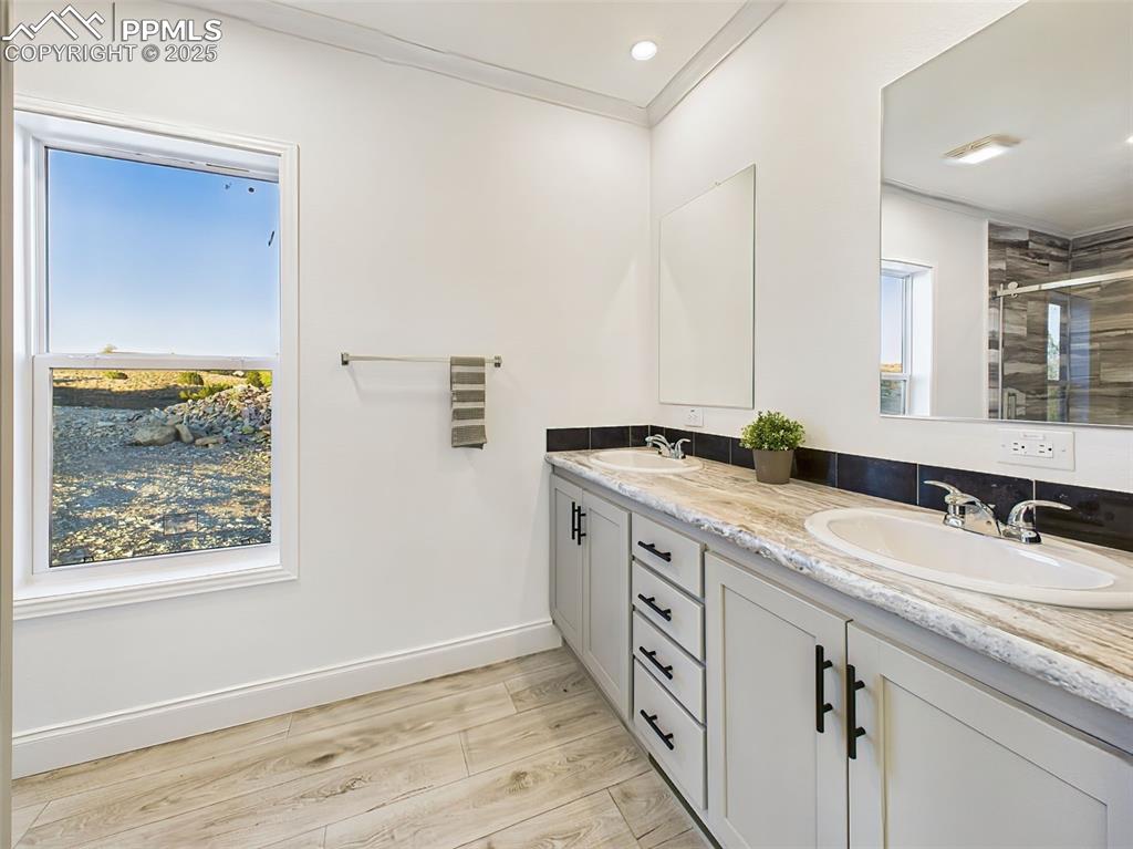 Beautifully appointed ensuite with dual sinks, and ample cabinetry.
