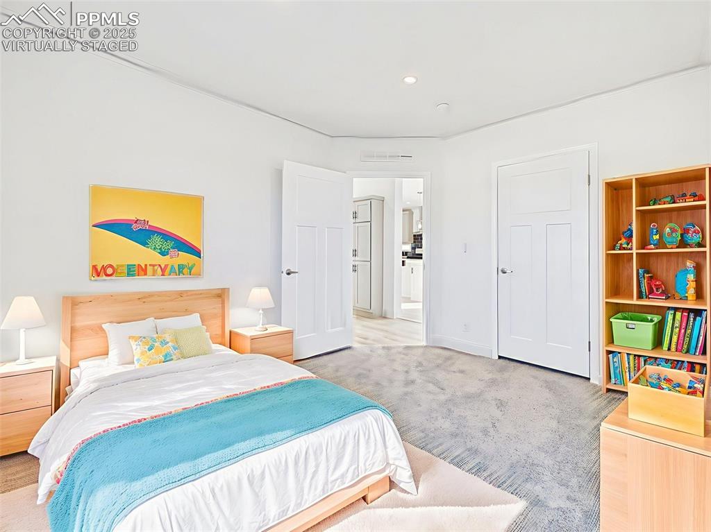 Virtually Staged Versatile secondary bedroom with neutral palette, virtually staged for use as a guest or home office.