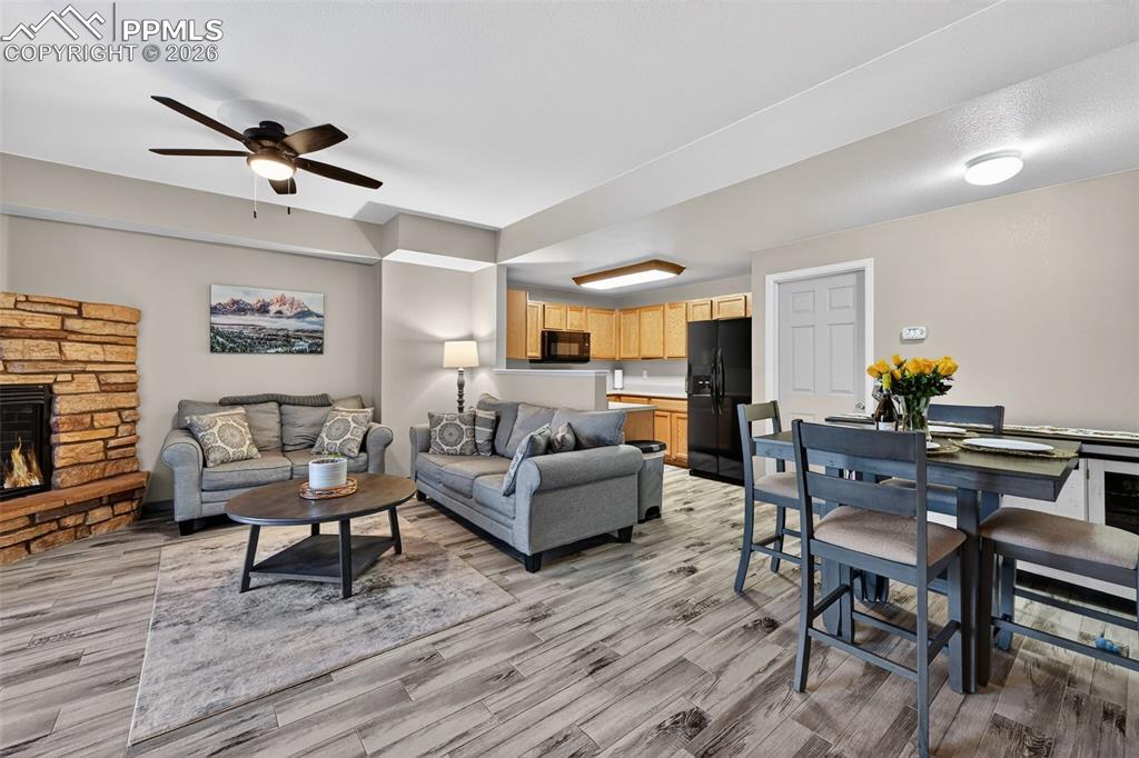 Enter into the living room, beautiful tiled floor, natural light, open floor plan on main level with walk out to front deck area.