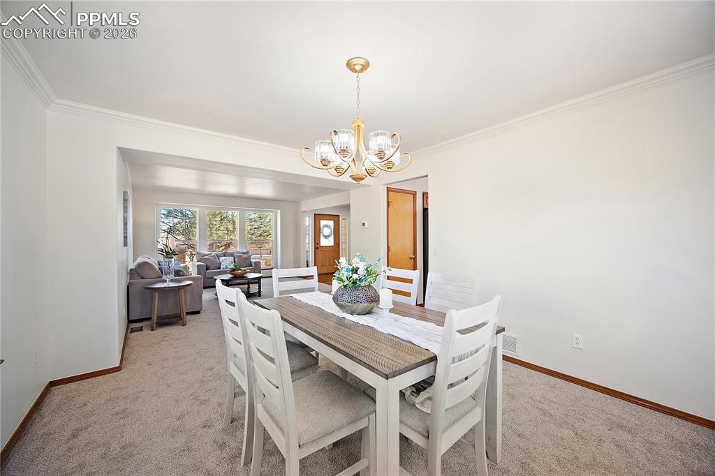 Formal dining just off the kitchen and open to the formal living. Great for entertaining. 