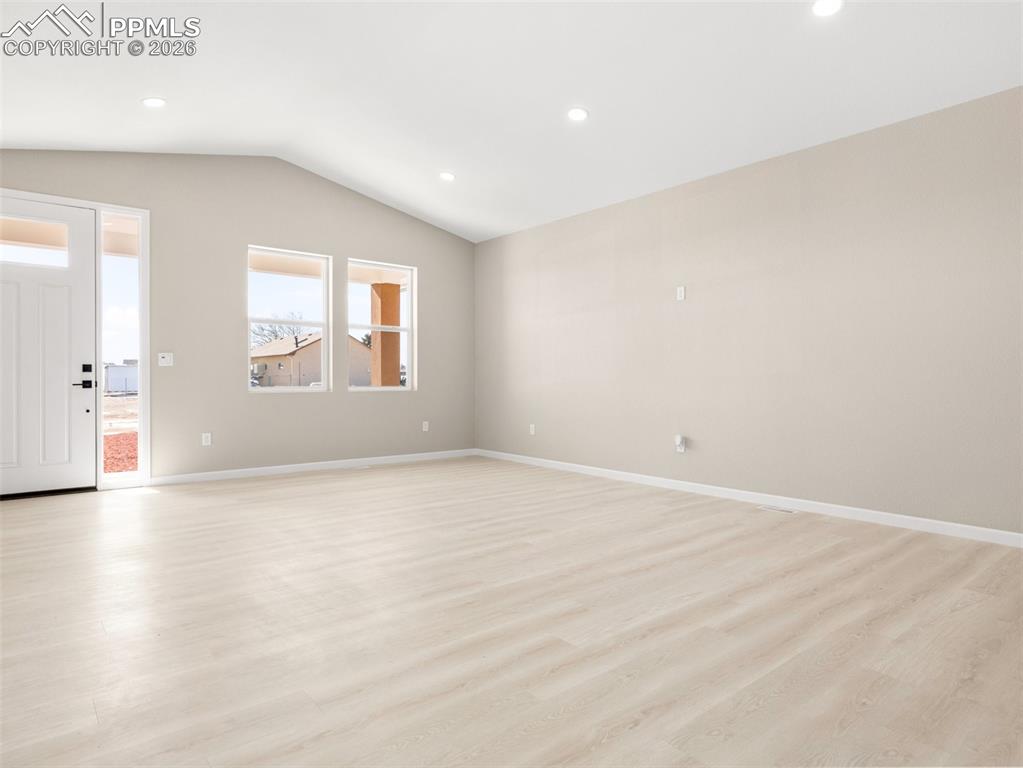 Additional view of front entrance and living room