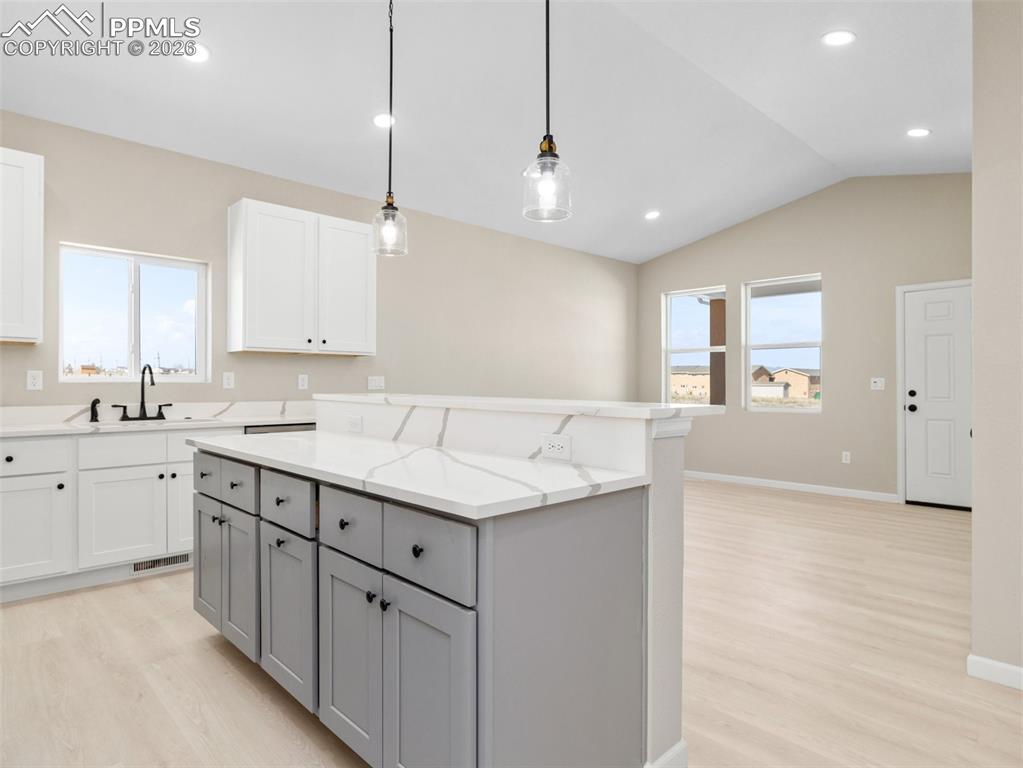 Great bar seating with quartz countertops and custom cabinets perfect for entertaining!