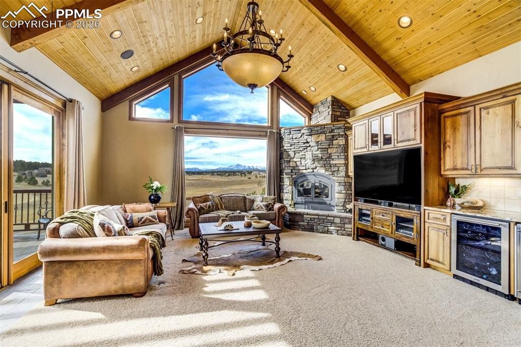 Here the world opens wide—Pikes Peak bold in the distance, meadows shifting with the light, and the fairways of King’s Deer falling away below. Each window frames a different story of sky, weather, and the ever-changing Colorado landscape