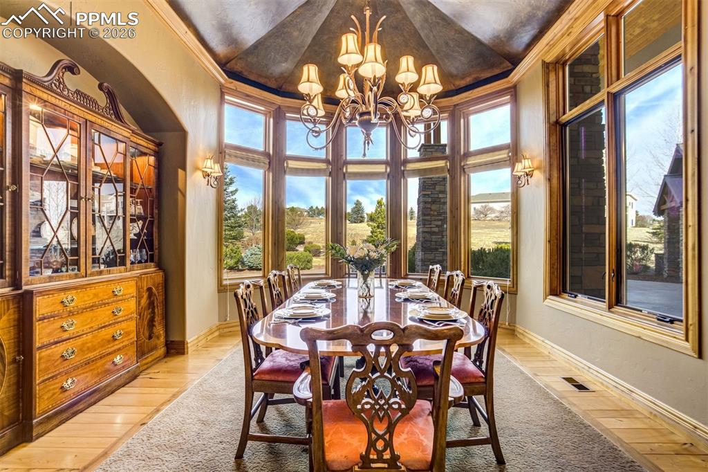 A gracious dining room made for celebrations, where long tables, good conversation, and shared meals become part of the memories written into this home