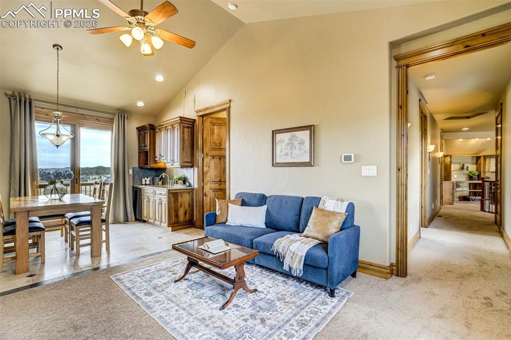 At the center of the east wing, a welcoming lounge with kitchenette and dining nook creates a comfortable gathering space for morning coffee or quiet evenings