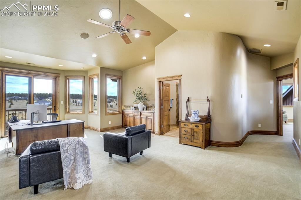 West Wing Executive Office / Lounge

A distinguished executive-style space in the west wing offers the perfect setting for a private office or quiet retreat, complete with a wet bar/coffee bar and walkout access to its own secluded deck