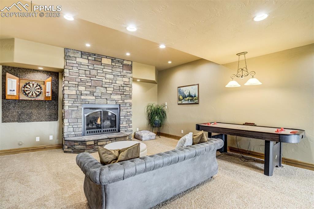 The lower level creates a welcoming hub for entertaining, offering space for cocktails, conversation, and relaxed evenings with friends and family