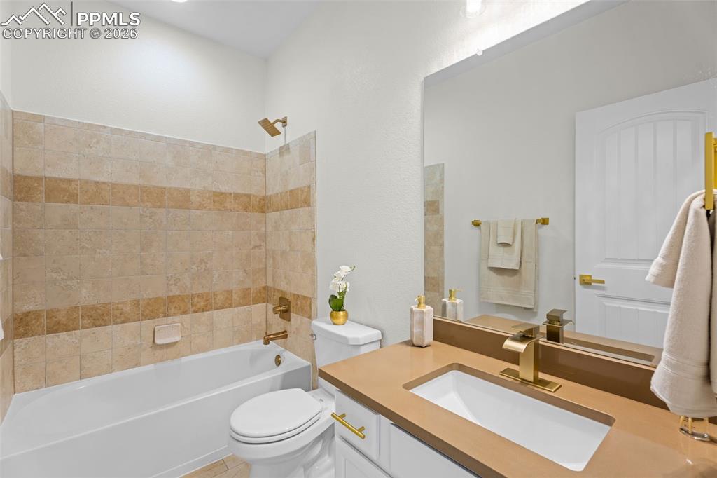 Bathroom with vanity and shower / bathtub combination