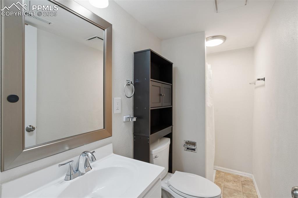 Bathroom featuring vanity and light tile patterned floors