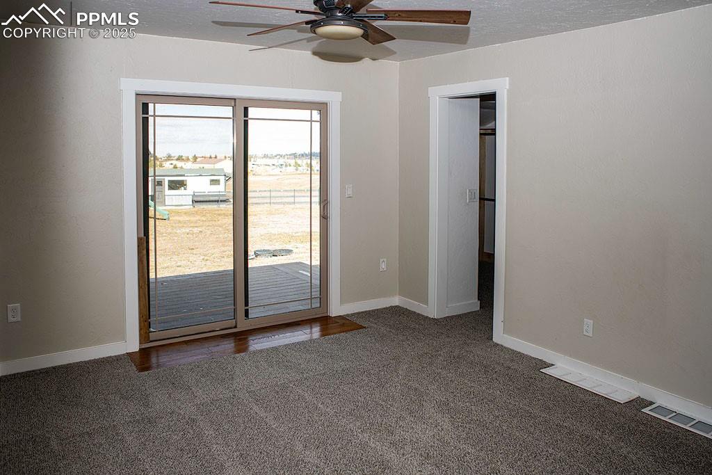 Main level primary bedroom with walkout