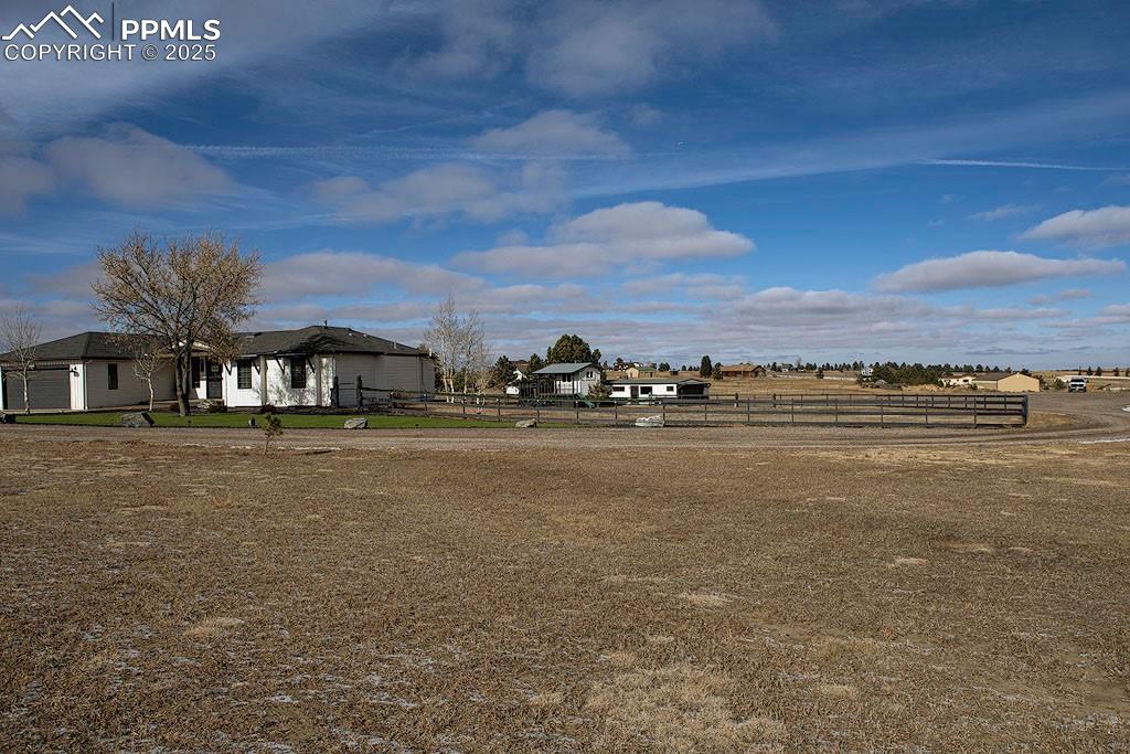 Property View of fenced yard, playhouse and detached garage.