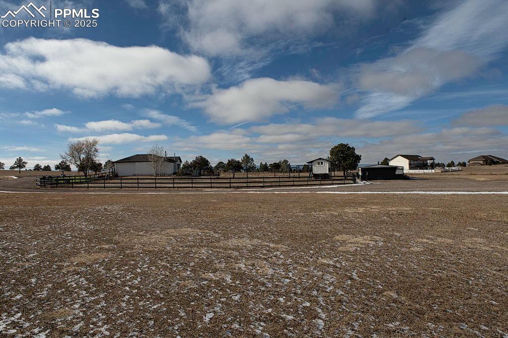 Property side view of fenced backyard