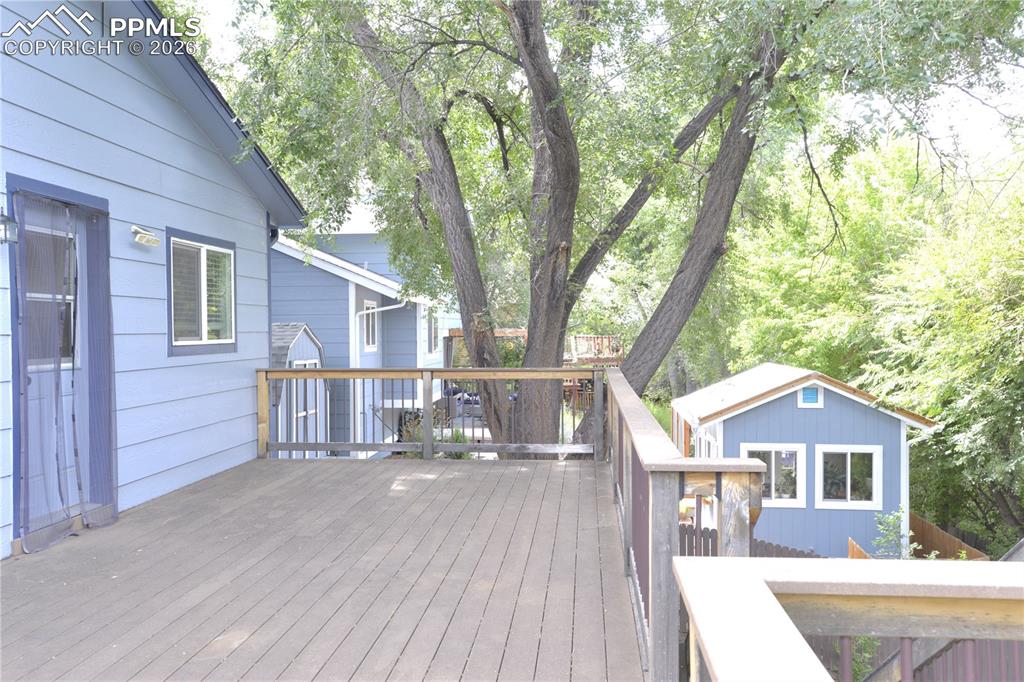 This amazing full-width deck offers privacy, and 