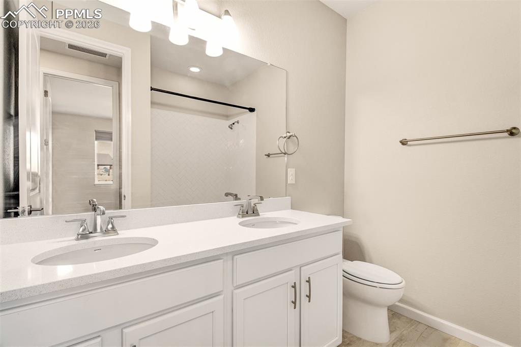 Second main level bathroom with dual vanities
