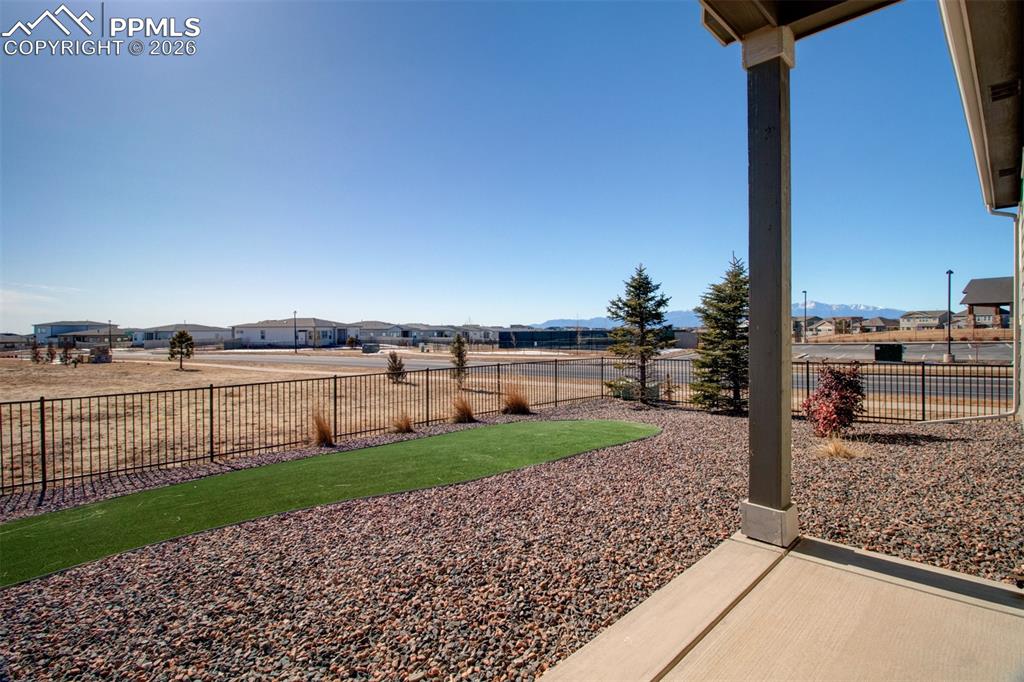 Covered back patio with views of Pikes Peak