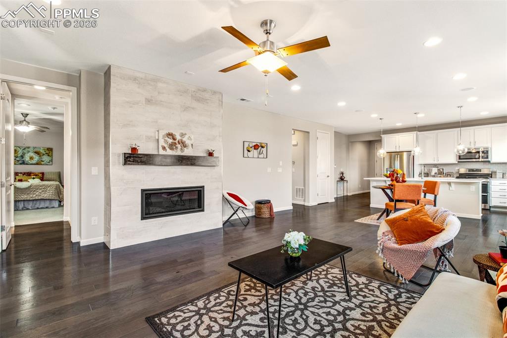 Open main level with natural wood floors and loads of light