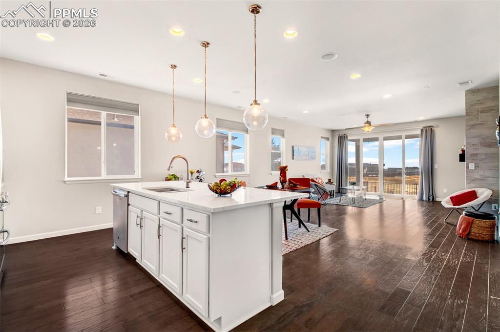 Open layout with natural wood flooring