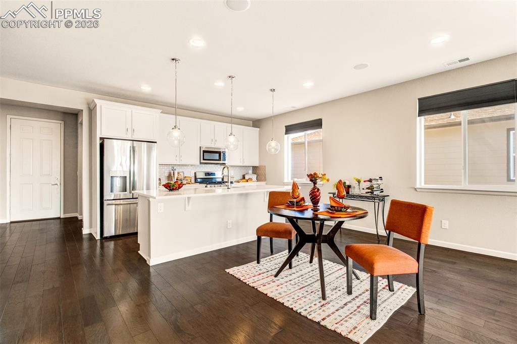 Quartz countertops with an island and breakfast bar
