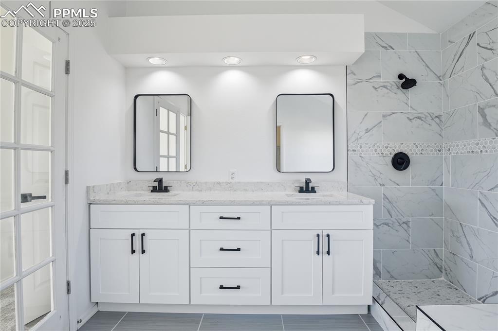 Bathroom with double vanity and walk in shower