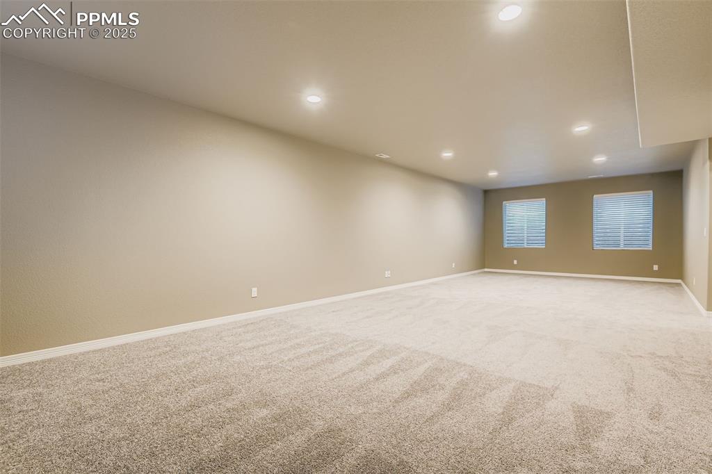 Unfurnished room with carpet and recessed lighting