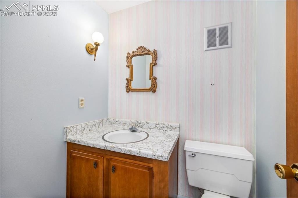Bathroom with vanity and toilet