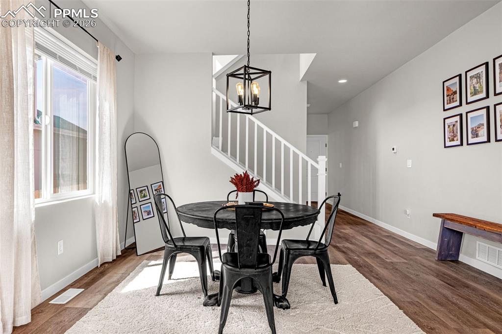 Dining area on main level, great natural light, luxury vinyl plank flooring, updated fixtures